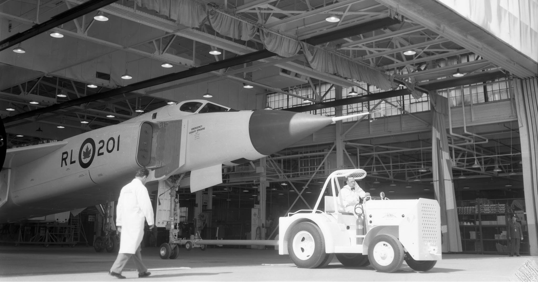 May be an image of 2 people, aircraft and text