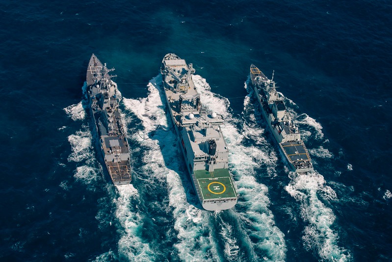 May be an image of helicopter, submarine, ocean and text